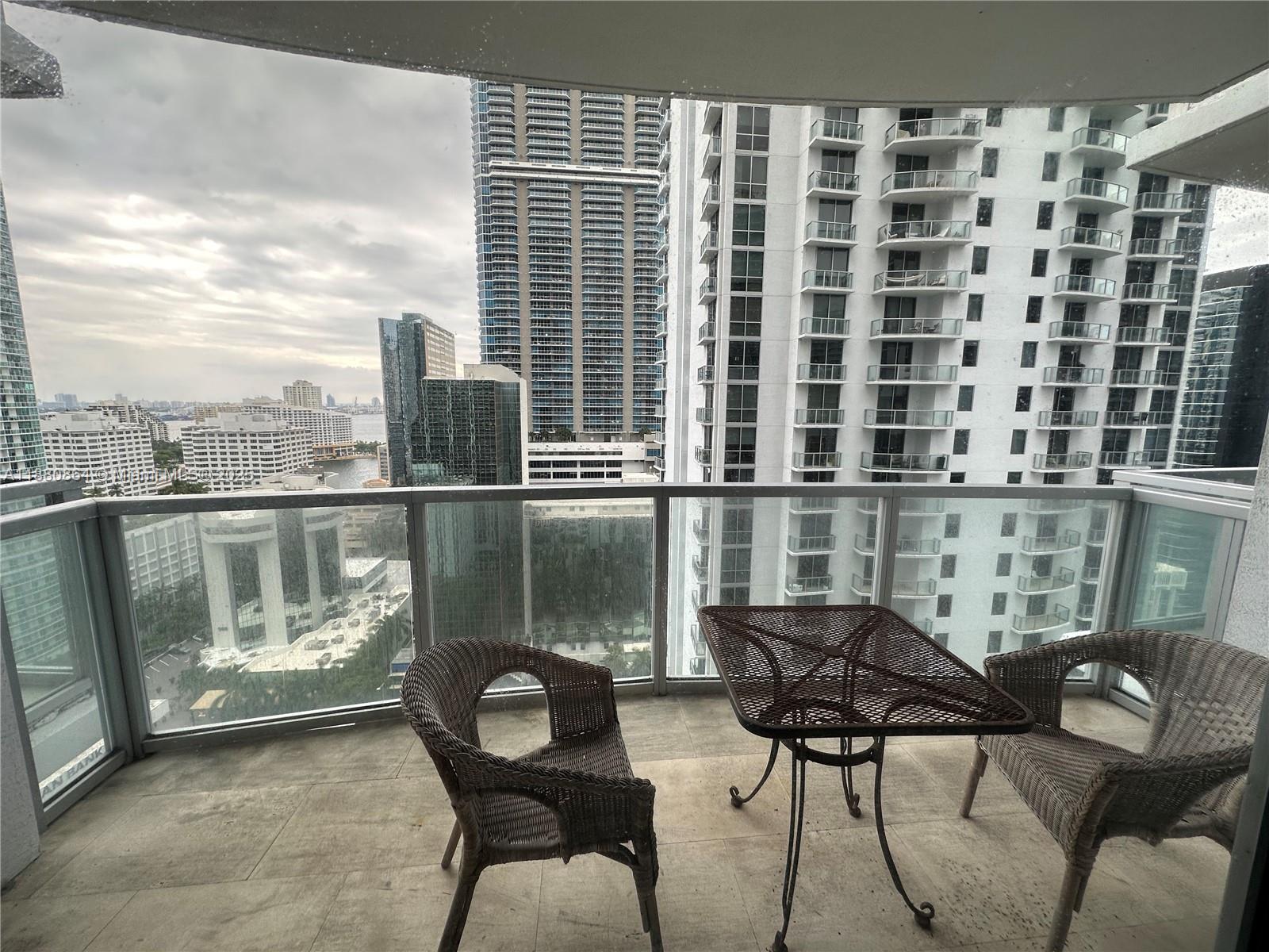1050 Brickell Avenue, Unit 2206 Miami, FL 33131 - Photo 8 of 9 a balcony view with a seating space