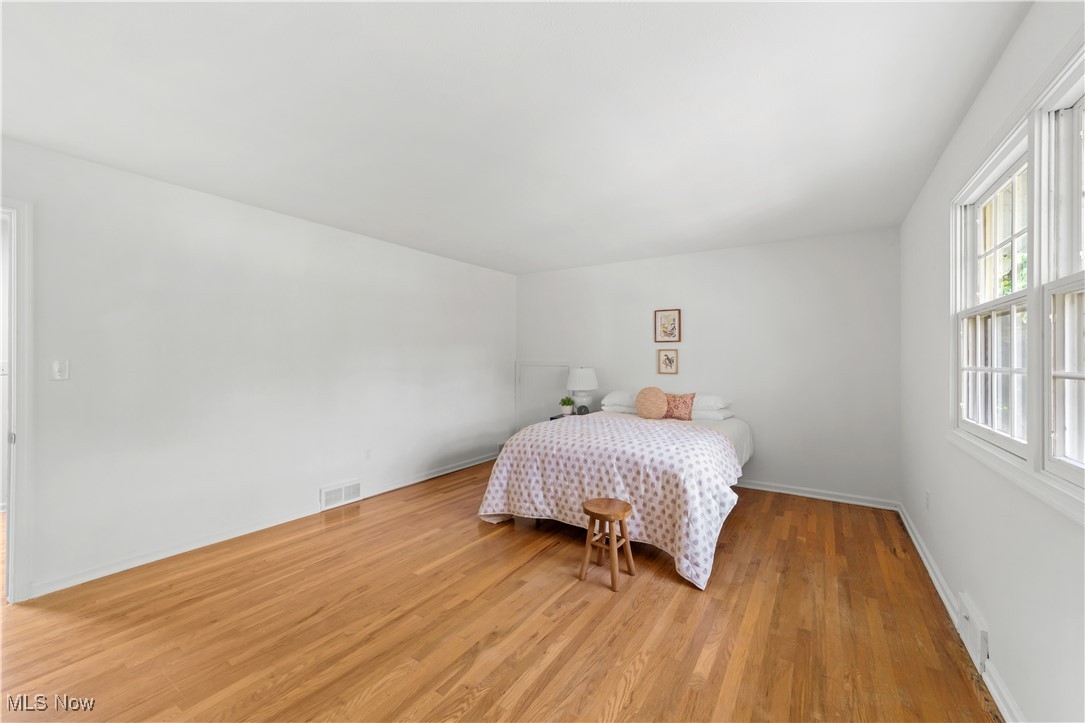 5588 River Styx Road Medina, OH 44256 - Photo 18 of 50 Bedroom featuring light hardwood / wood-style flooring