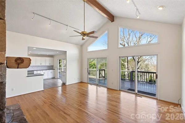 a view of a living room and a wooden floor
