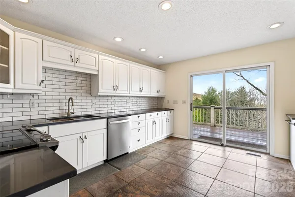 a large kitchen with a large window