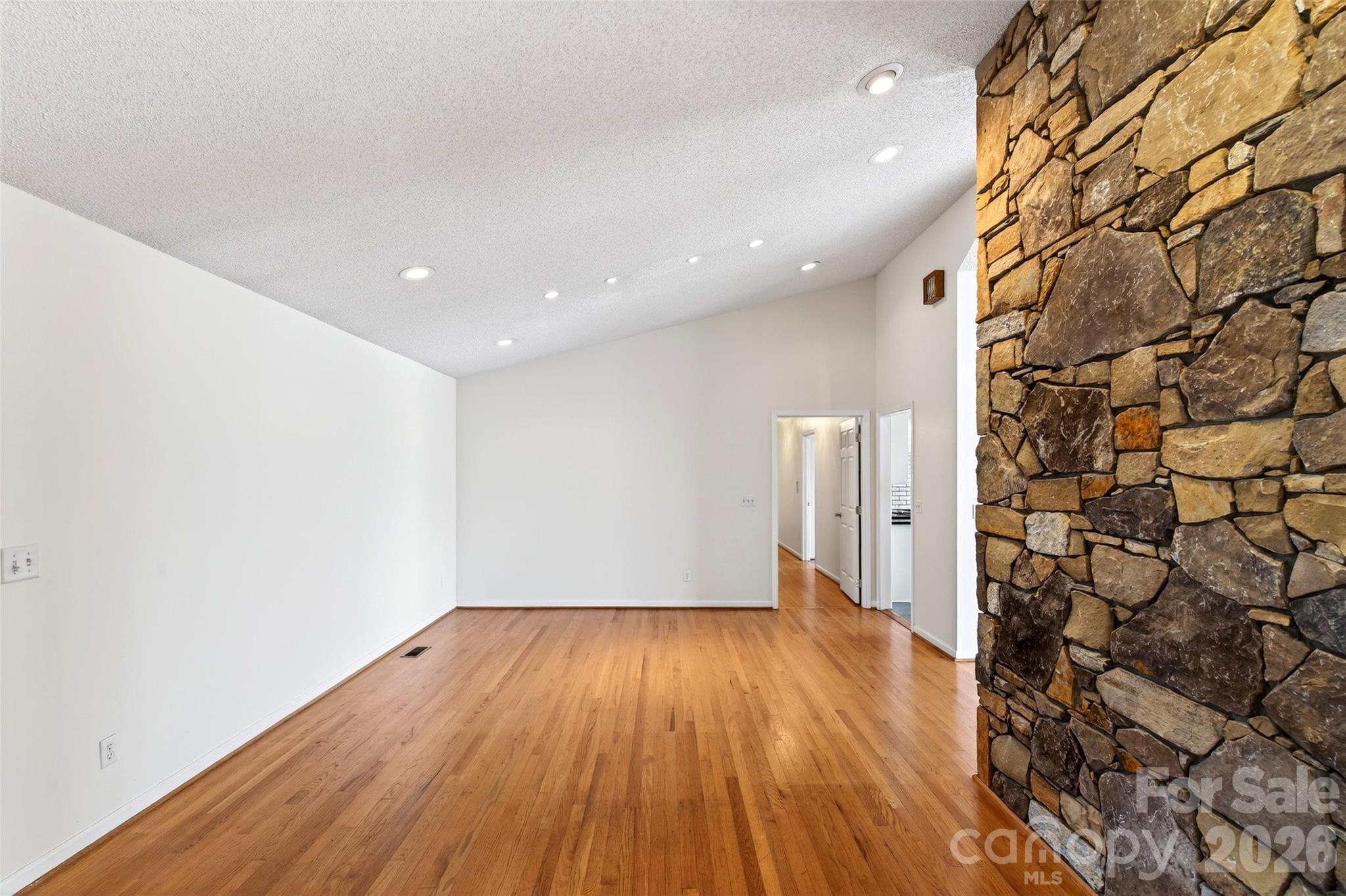 3 Tree Top Place Black Mountain, NC 28711 - Photo 21 of 43 a view of an empty room with wooden floor and a window