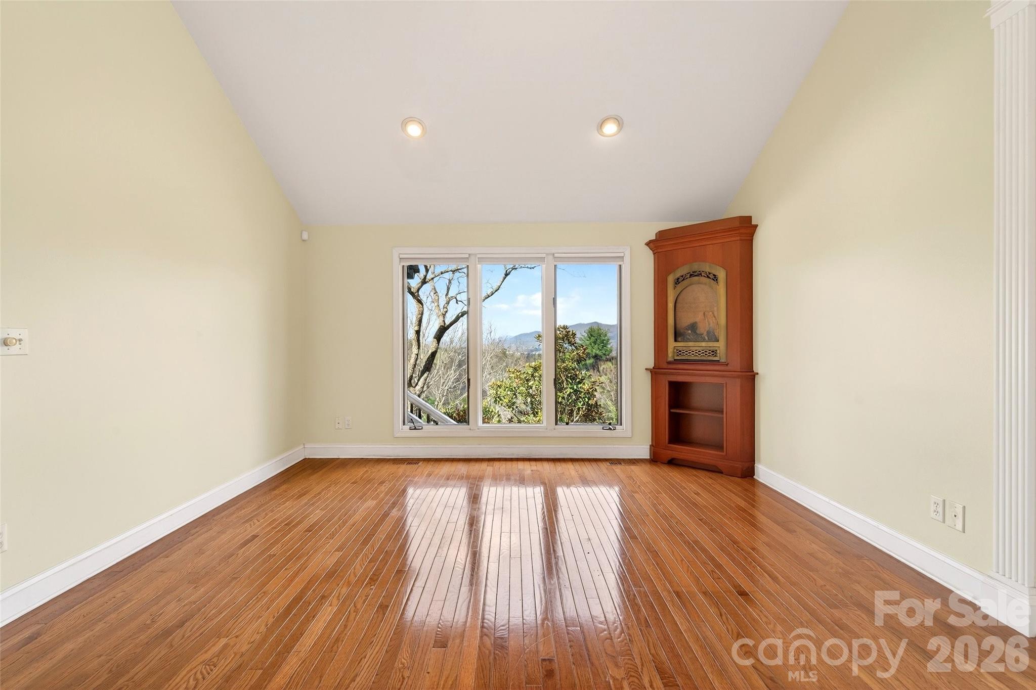 3 Tree Top Place Black Mountain, NC 28711 - Photo 26 of 43 an empty room with wooden floor and a window