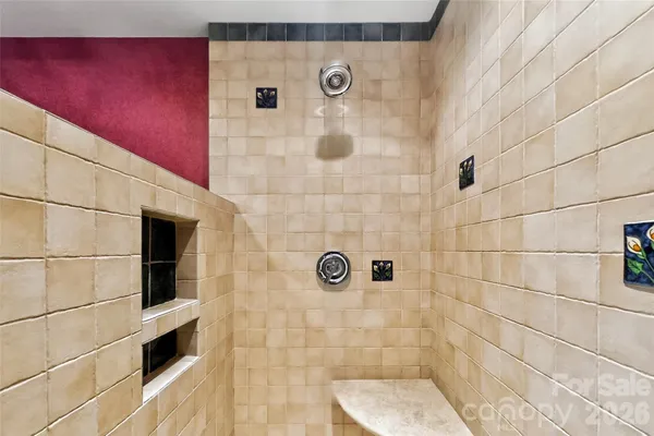 a view of an empty room with empty shelves