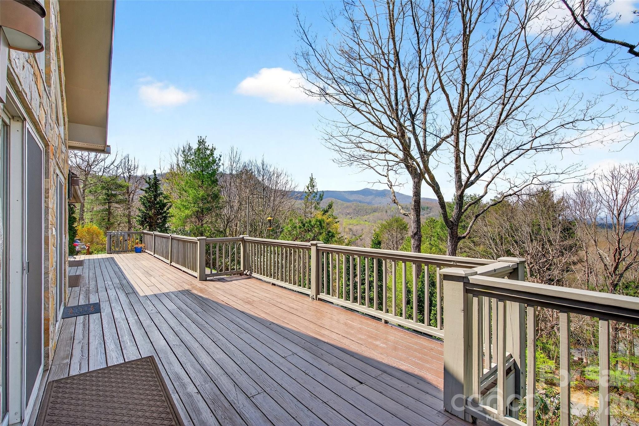 3 Tree Top Place Black Mountain, NC 28711 - Photo 4 of 43 a view of a balcony with wooden floor and fence