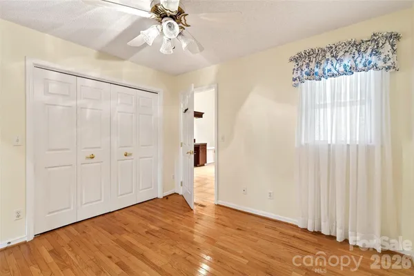 wooden floor in an empty room and a window