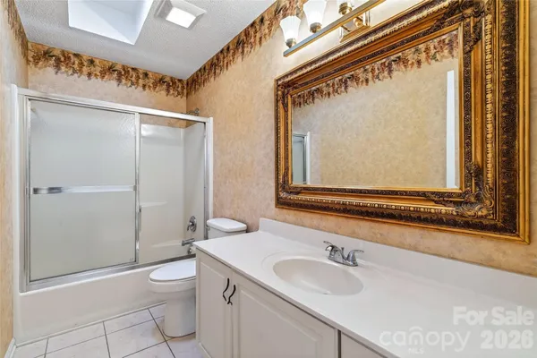 a view of a terrace with a garden and trees