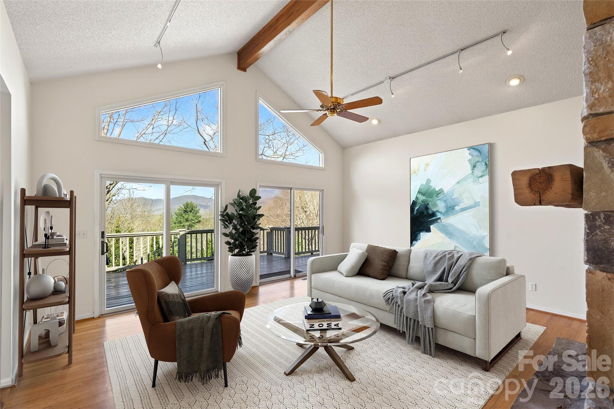 3 Tree Top Place Black Mountain, NC 28711 - Photo 8 of 43 a living room with furniture a ceiling fan and a large window