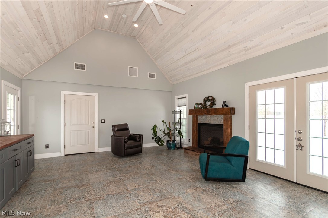 18919 Ravenna Road Chagrin Falls, OH 44023 - Photo 13 of 48 The Family Room cathedral ceiling, recessed lighting, ceiling fan and a tile floor is large enough for gatherings with friends and family
