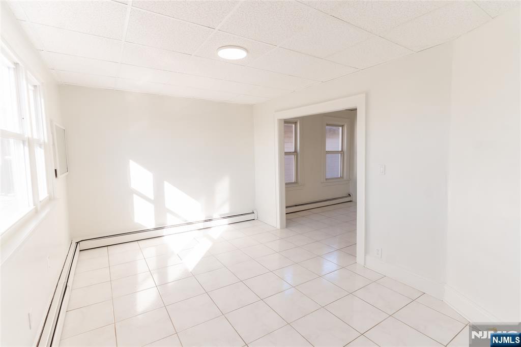 125 Clark Place, Unit 123 Elizabeth, NJ 07206 - Photo 2 of 16 a view of an empty room and window