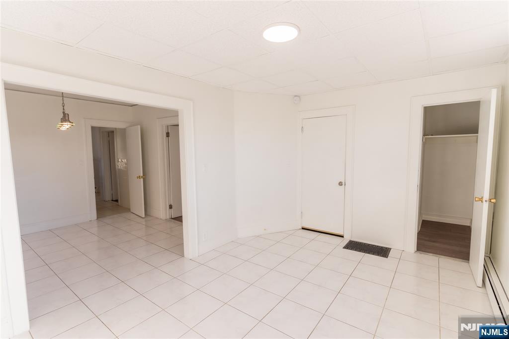 125 Clark Place, Unit 123 Elizabeth, NJ 07206 - Photo 4 of 16 an empty room with a bathroom