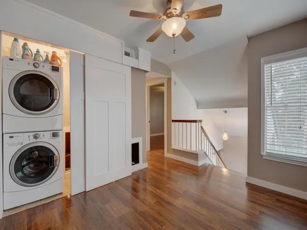 a view of a hallway with washer and dryer