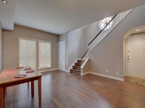 a view of entryway with wooden floor and stairs