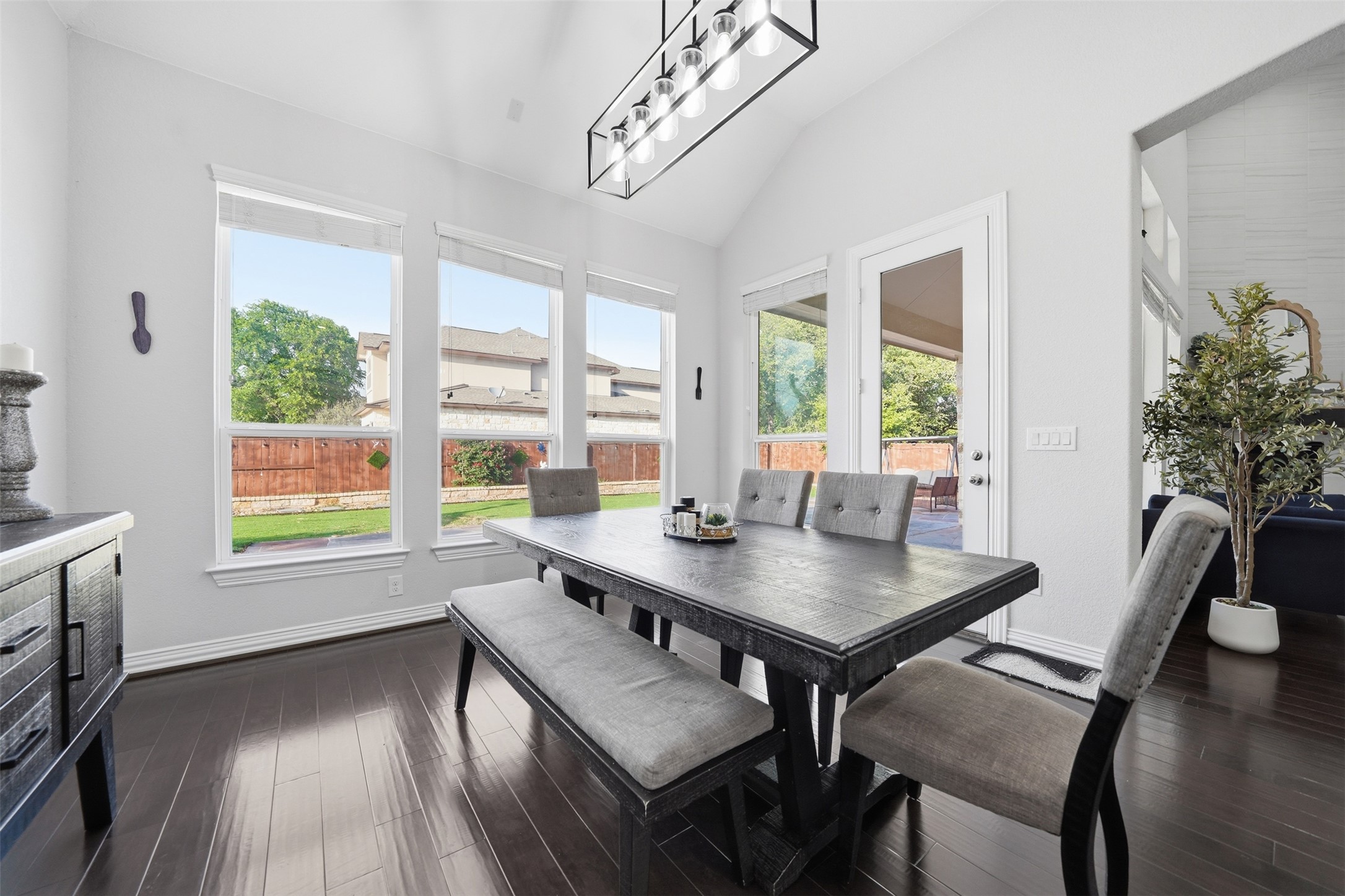 4301 Logan Ridge Drive Cedar Park, TX 78613 - Photo 15 of 38 Dining area with lofted ceiling, dark wood finished floors, and healthy amount of natural light