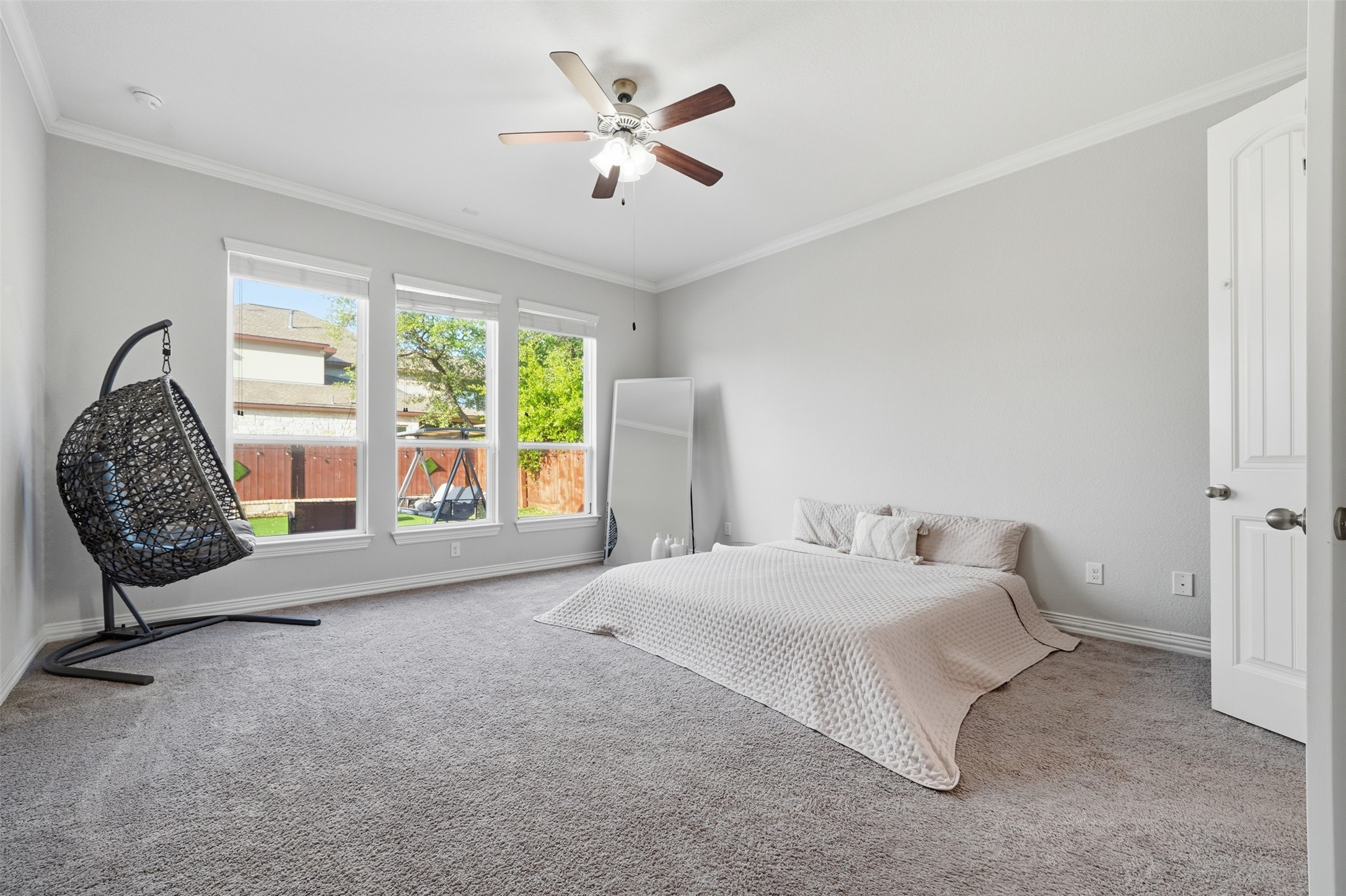 4301 Logan Ridge Drive Cedar Park, TX 78613 - Photo 16 of 38 Bedroom with carpet floors, ornamental molding, and ceiling fan