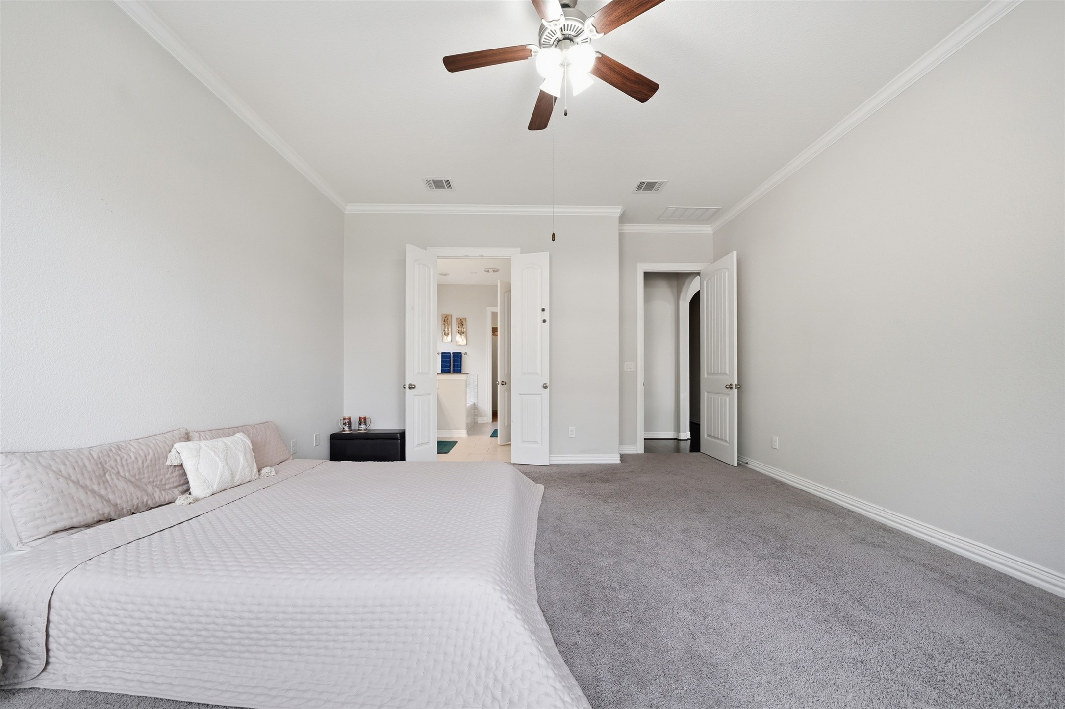 4301 Logan Ridge Drive Cedar Park, TX 78613 - Photo 17 of 38 Bedroom featuring carpet flooring, a ceiling fan, and ornamental molding