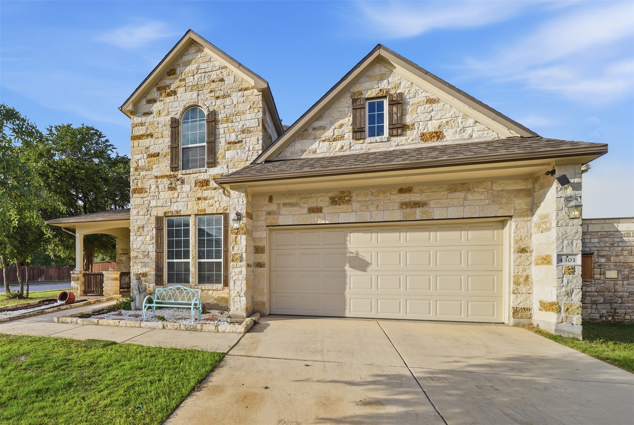 4301 Logan Ridge Drive Cedar Park, TX 78613 - Photo 2 of 38 French country inspired facade with stone siding, driveway, covered porch, and a front lawn