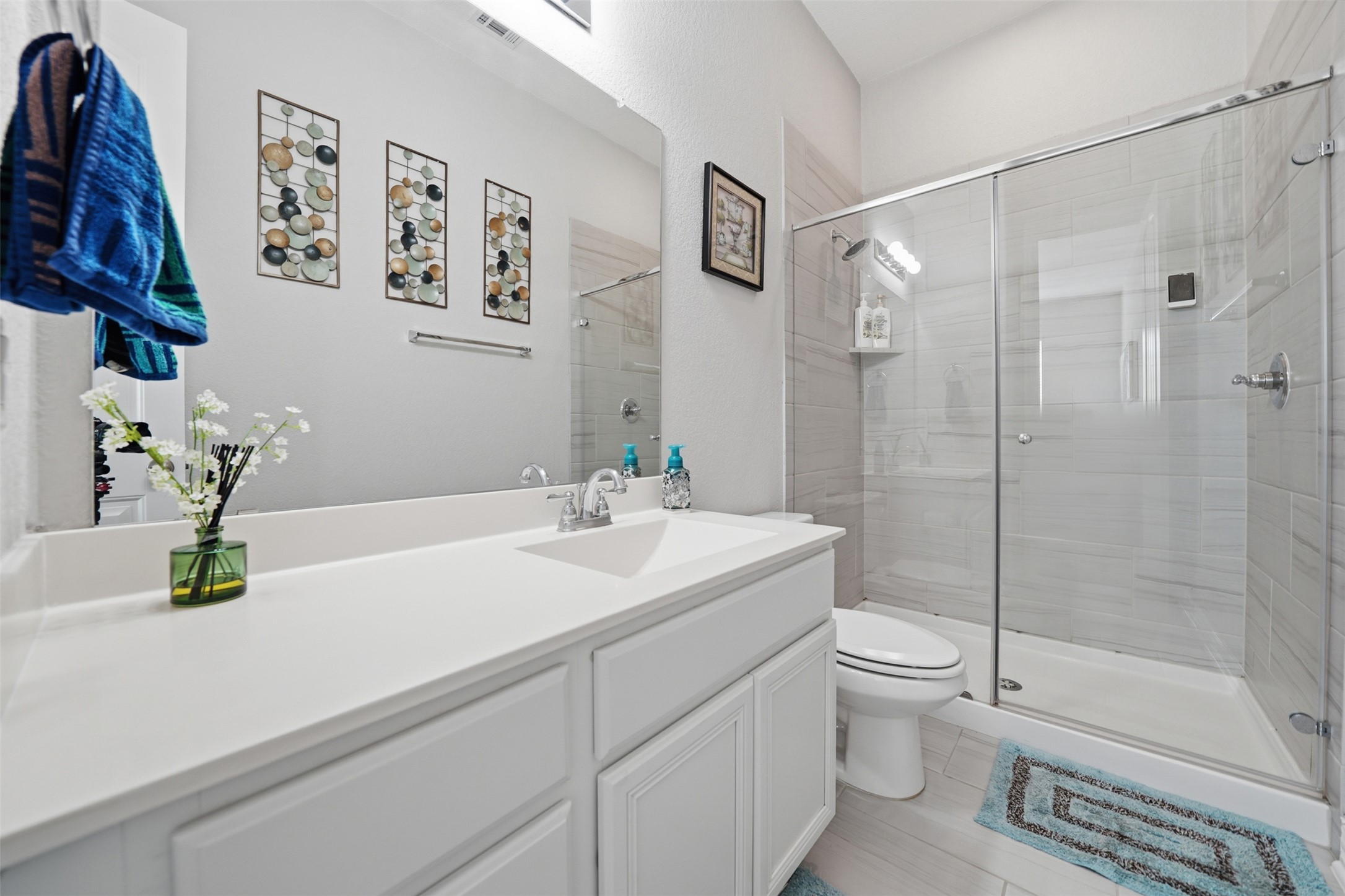 4301 Logan Ridge Drive Cedar Park, TX 78613 - Photo 21 of 38 Bathroom featuring vanity and a stall shower