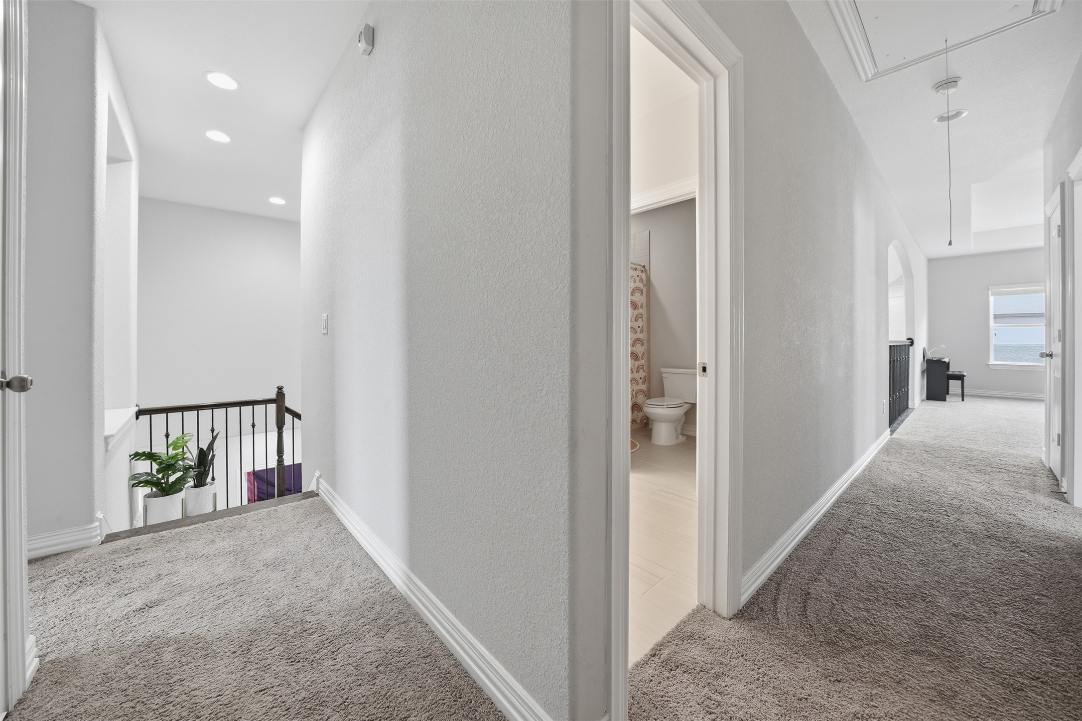4301 Logan Ridge Drive Cedar Park, TX 78613 - Photo 24 of 38 Corridor featuring light carpet, a textured wall, and an upstairs landing