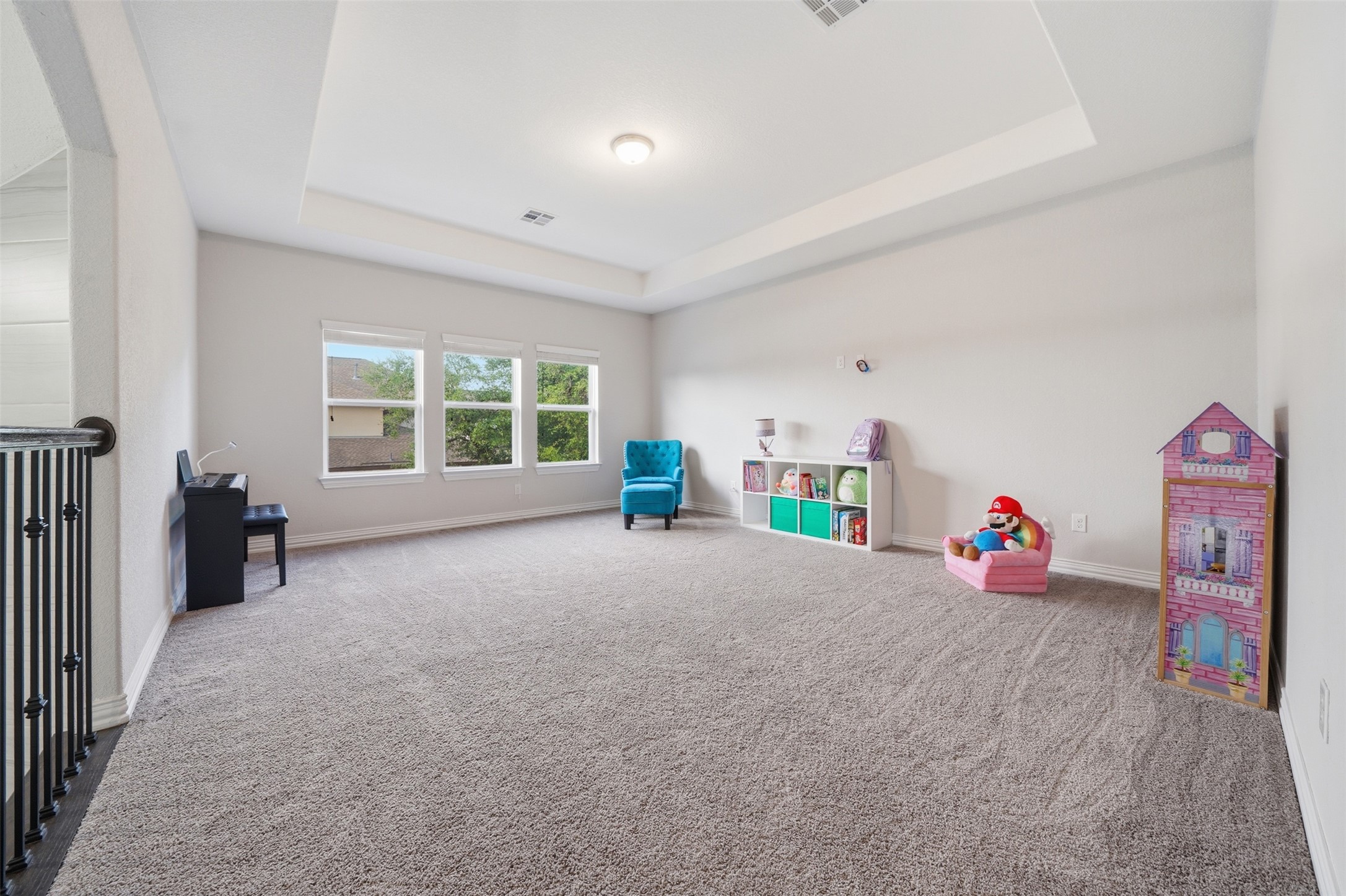 4301 Logan Ridge Drive Cedar Park, TX 78613 - Photo 26 of 38 Recreation room featuring carpet flooring and a raised ceiling