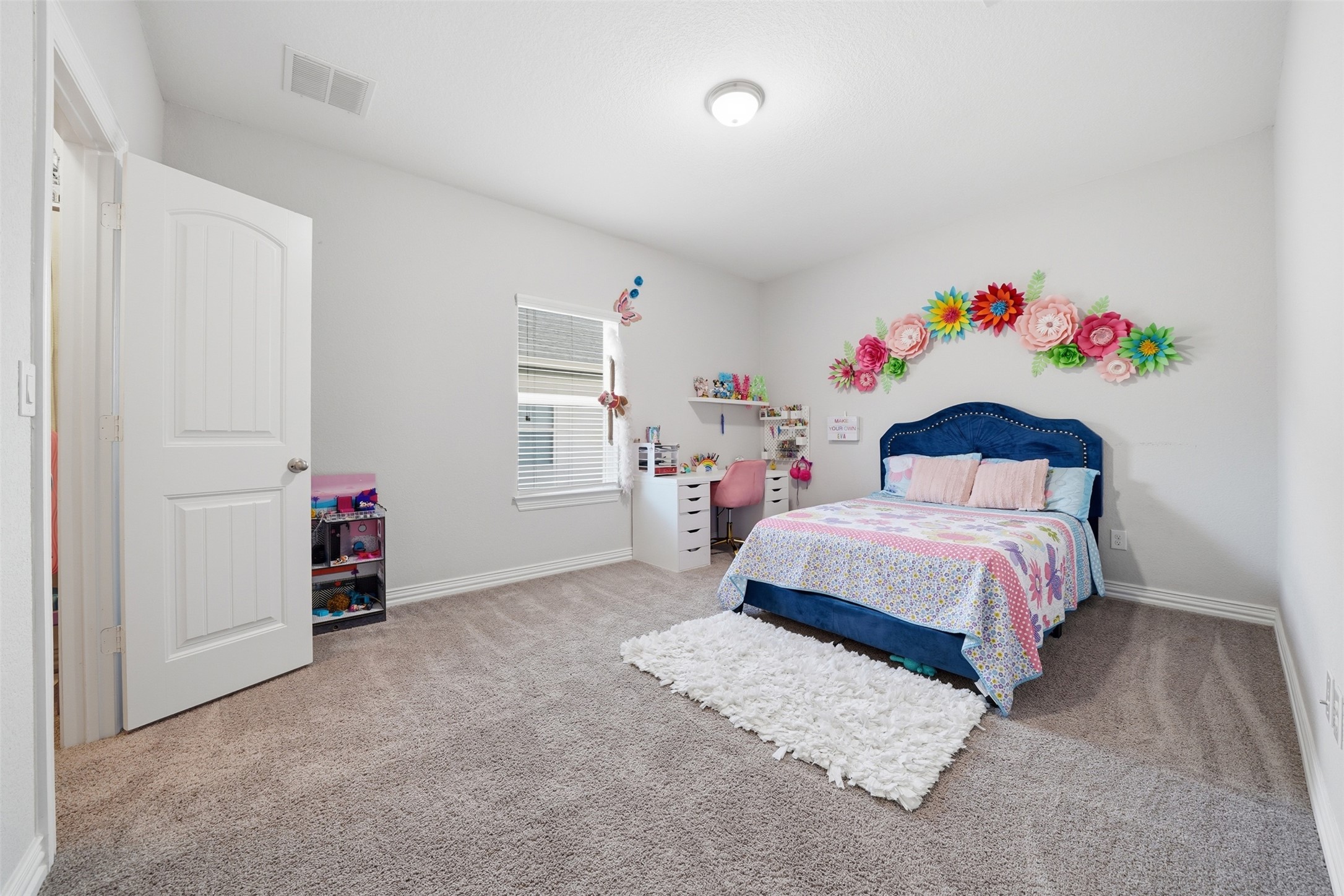 4301 Logan Ridge Drive Cedar Park, TX 78613 - Photo 29 of 38 Bedroom with light colored carpet and baseboards