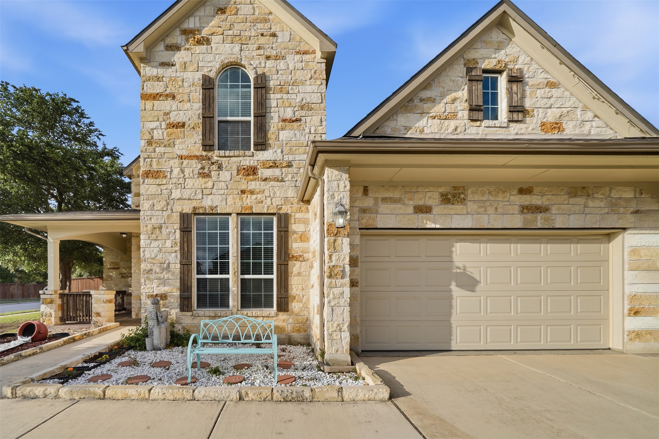 4301 Logan Ridge Drive Cedar Park, TX 78613 - Photo 4 of 38 French provincial home featuring stone siding, driveway, a garage, and a porch