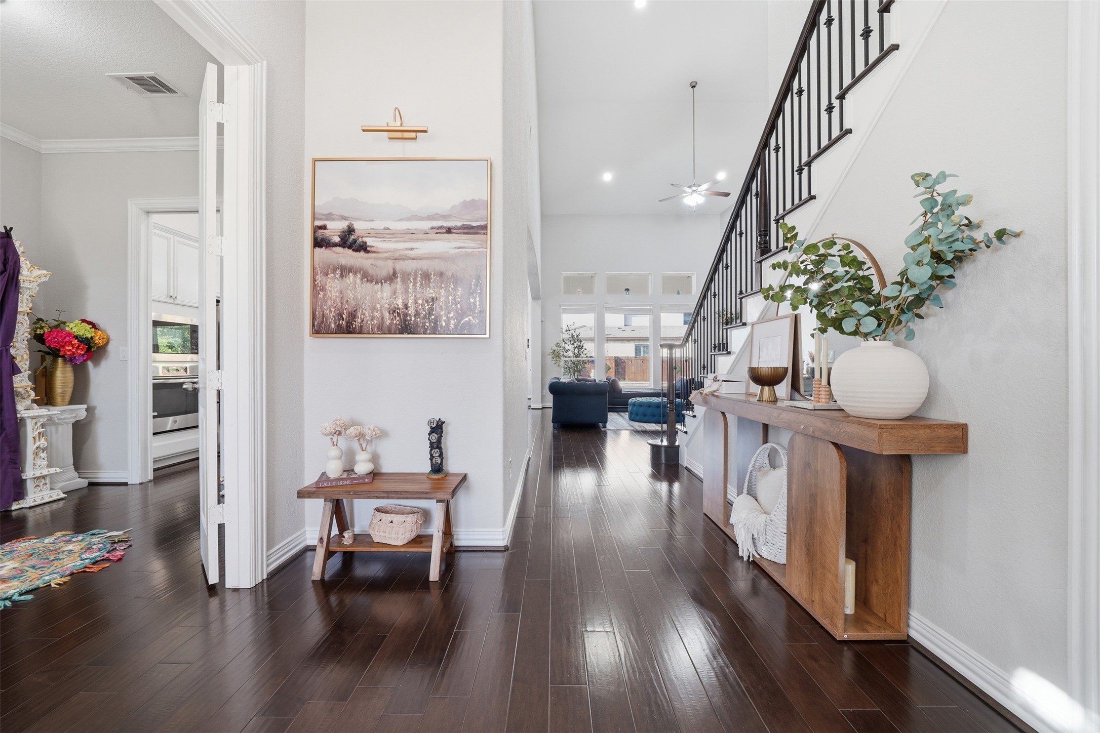 4301 Logan Ridge Drive Cedar Park, TX 78613 - Photo 10 of 38 Corridor with dark wood-style flooring and a high ceiling