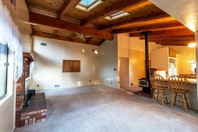 25020 Rim Rock Road Idyllwild, CA 92549 - Photo 11 of 34 a view of a livingroom with furniture and floor to ceiling window