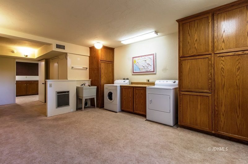 25020 Rim Rock Road Idyllwild, CA 92549 - Photo 24 of 34 a view of a kitchen with furniture and a fireplace
