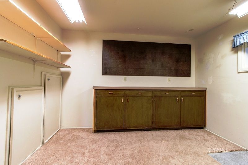 25020 Rim Rock Road Idyllwild, CA 92549 - Photo 25 of 34 a living room with a flat screen tv and a fireplace