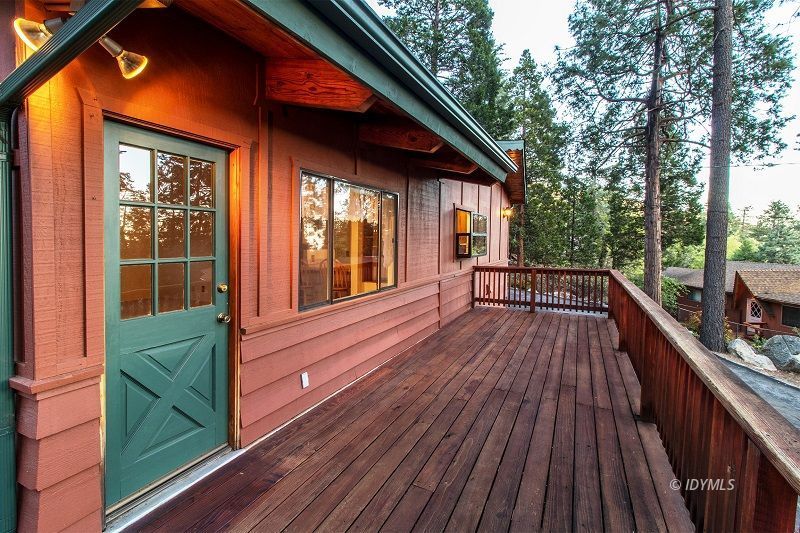 25020 Rim Rock Road Idyllwild, CA 92549 - Photo 27 of 34 a view of a house with backyard and deck