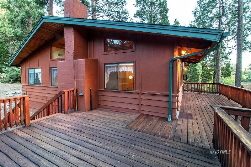 25020 Rim Rock Road Idyllwild, CA 92549 - Photo 7 of 34 a view of a wooden deck with a yard