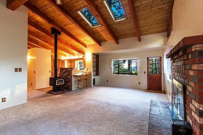25020 Rim Rock Road Idyllwild, CA 92549 - Photo 8 of 34 a view of livingroom with furniture and a fireplace
