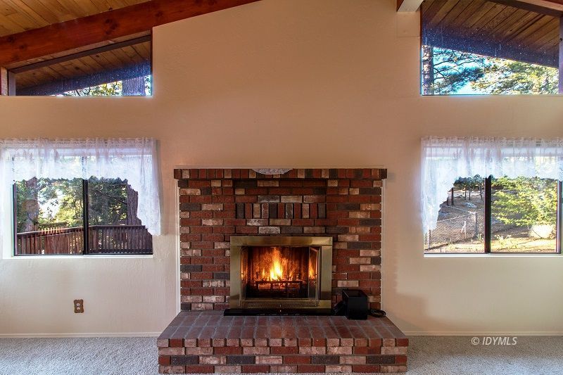 25020 Rim Rock Road Idyllwild, CA 92549 - Photo 10 of 34 a view of fireplace with window