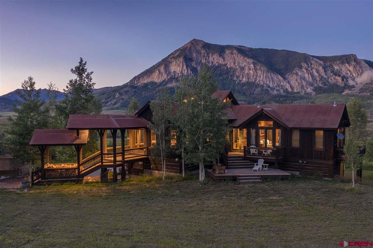 379 Smith Road Crested Butte, CO 81224 - Photo 1 of 35 a front view of a house with a yard