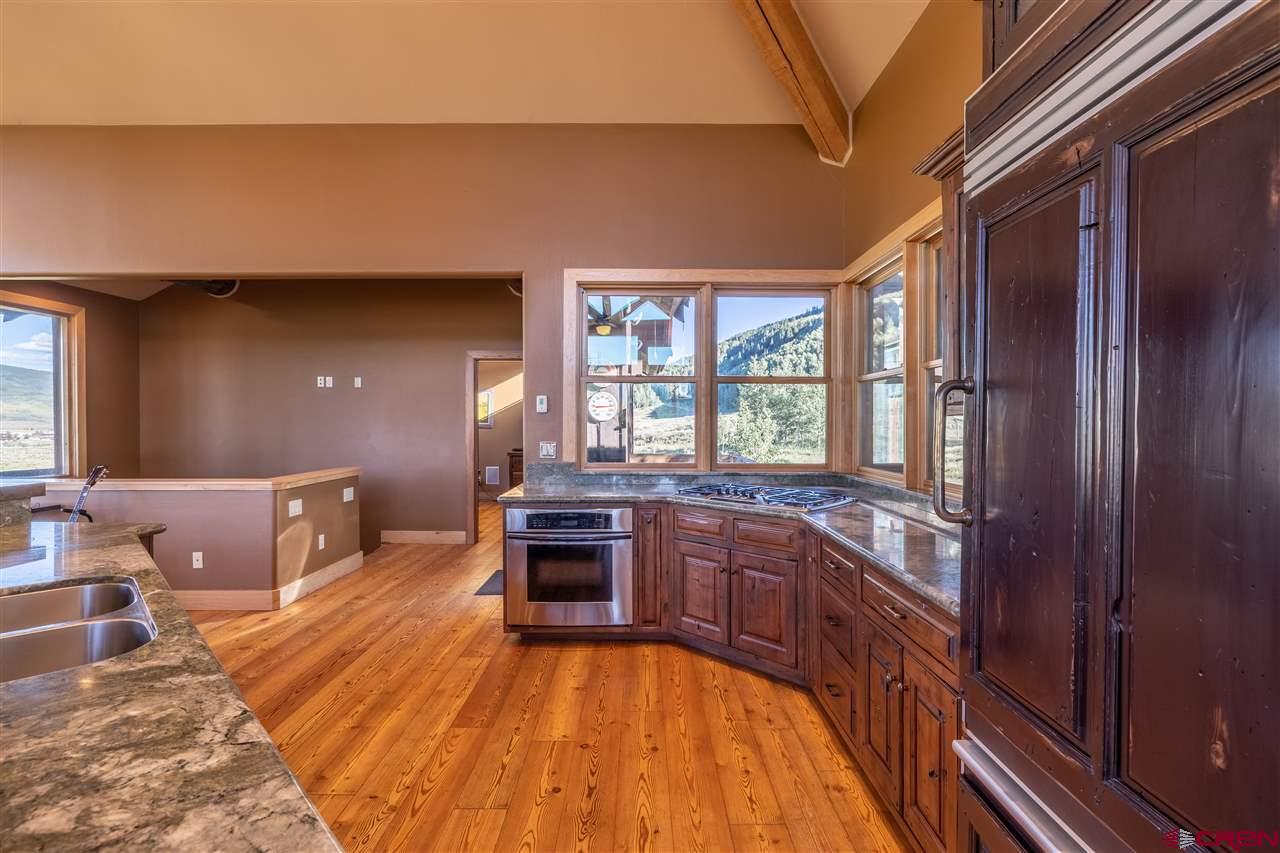 379 Smith Road Crested Butte, CO 81224 - Photo 11 of 35 a spacious bathroom with a large tub and sink