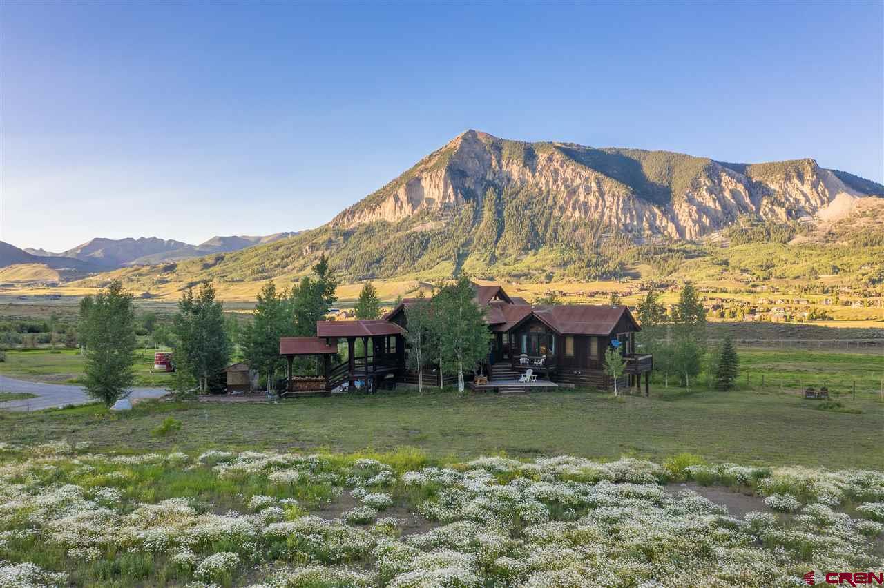 379 Smith Road Crested Butte, CO 81224 - Photo 3 of 35 a view of a house with a yard