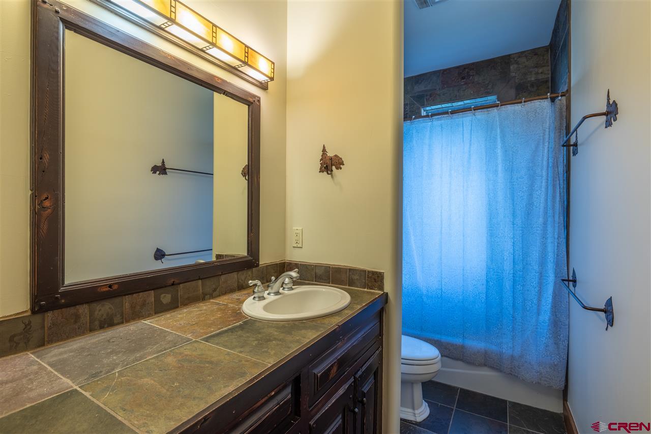 379 Smith Road Crested Butte, CO 81224 - Photo 26 of 35 a bathroom with a sink and a mirror