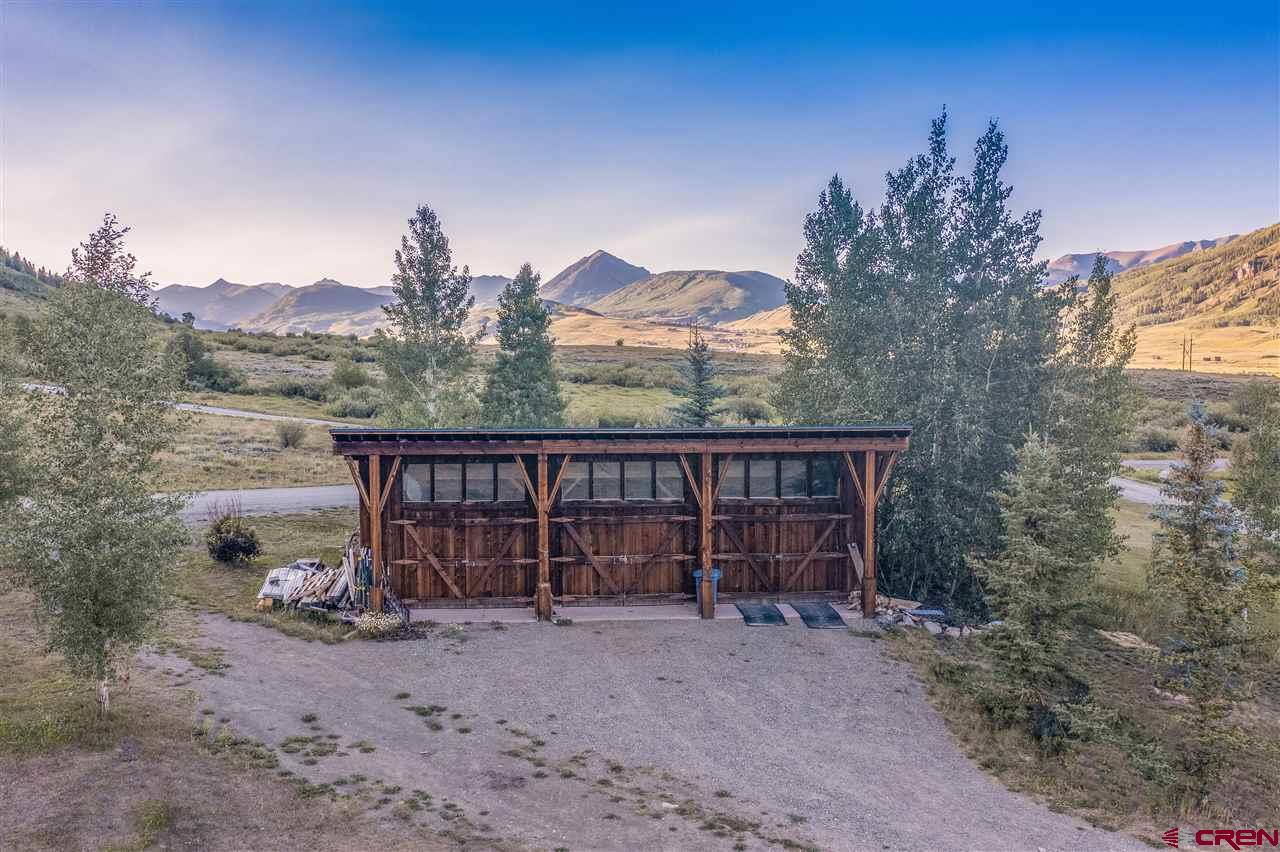379 Smith Road Crested Butte, CO 81224 - Photo 30 of 35 a view of a house with a backyard