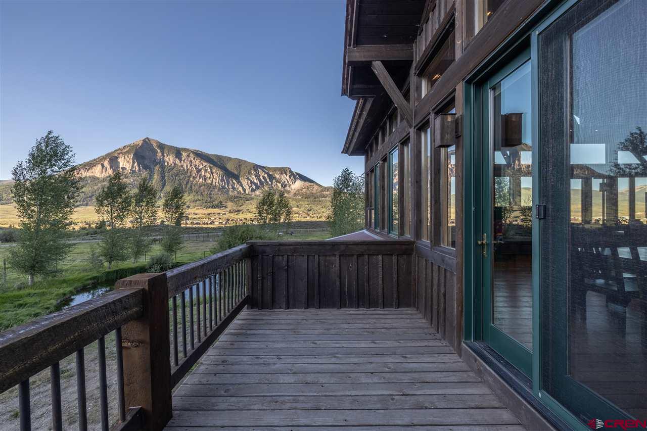 379 Smith Road Crested Butte, CO 81224 - Photo 34 of 35 a view of a house with a small deck