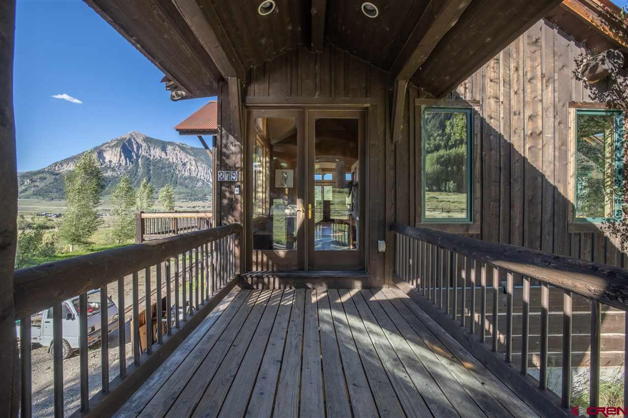 379 Smith Road Crested Butte, CO 81224 - Photo 8 of 35 a view of a balcony with wooden floor
