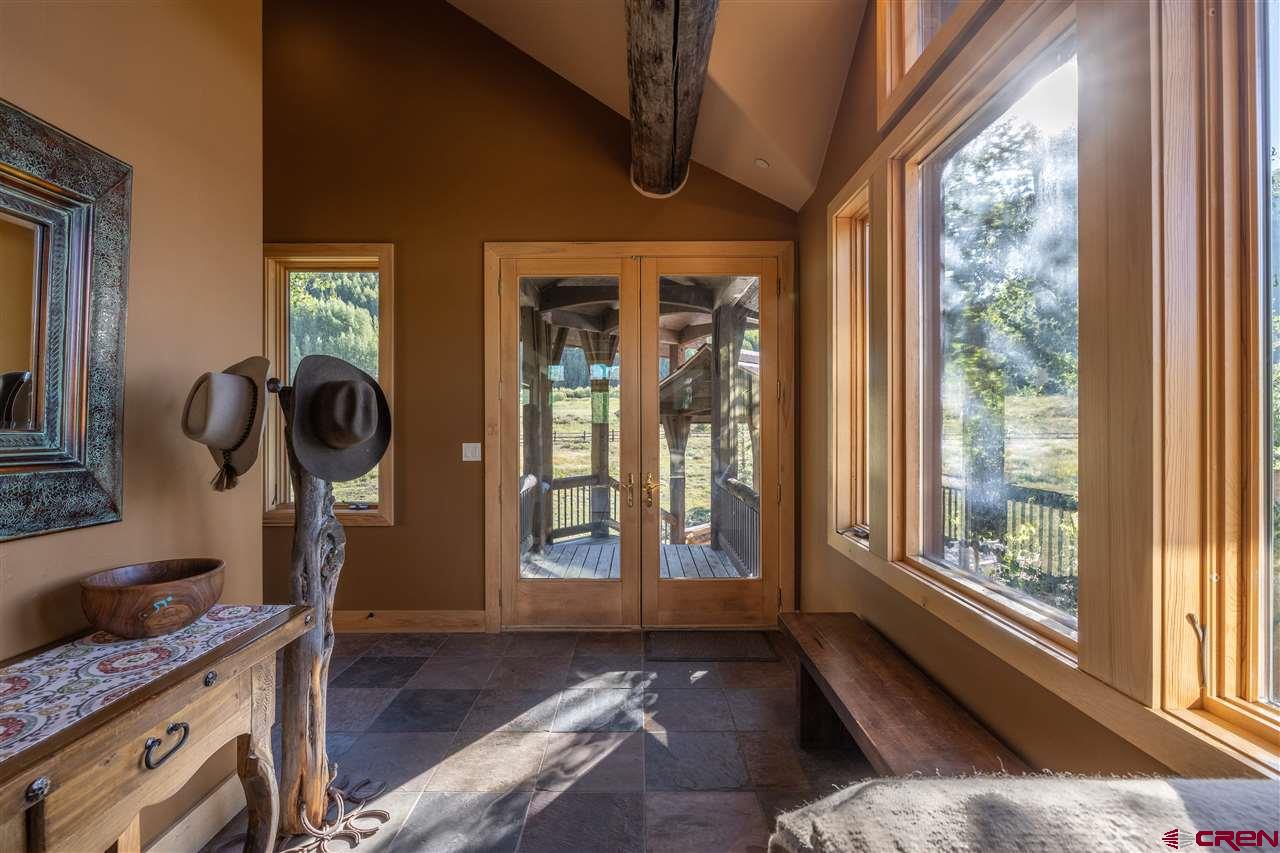 379 Smith Road Crested Butte, CO 81224 - Photo 9 of 35 a living room with furniture and a window