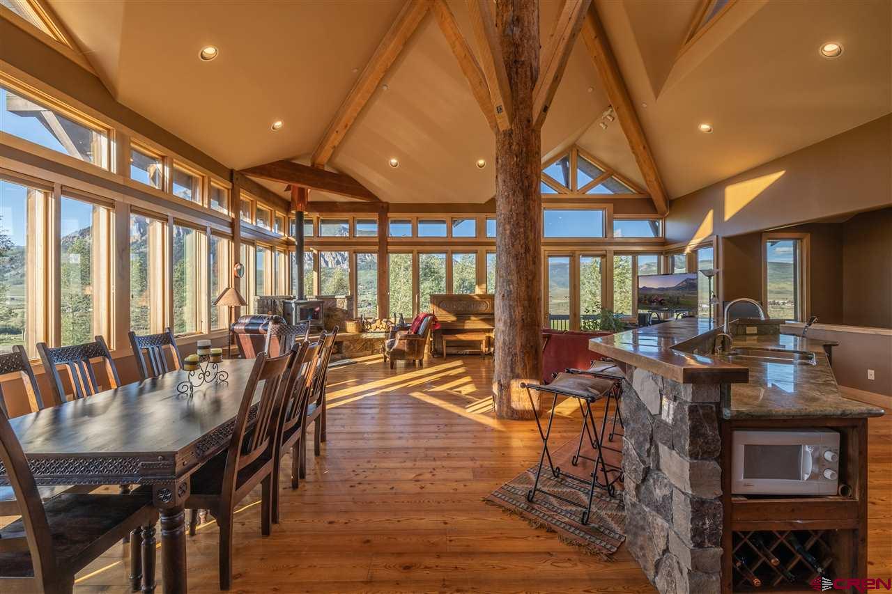 379 Smith Road Crested Butte, CO 81224 - Photo 10 of 35 a view of a dining room with furniture window and outside view
