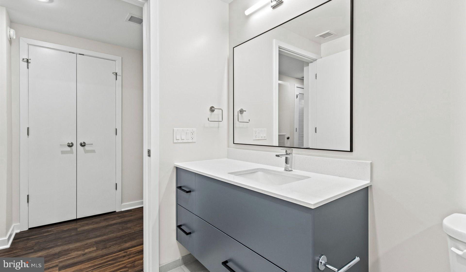 4000 Wisconsin Avenue Northwest, Unit 4K236 Washington, DC 20016 - Photo 51 of 54 a bathroom with a sink and a mirror