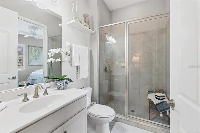 a bedroom with a bed couch and a window