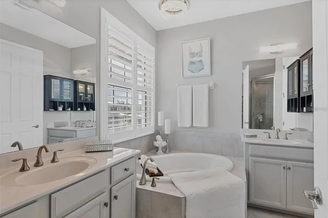 a aerial view of a house with a garden and lake view