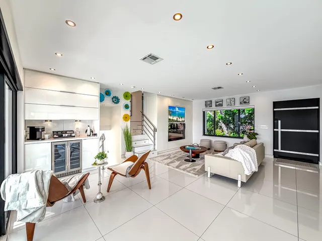 a view of a balcony with furniture and a floor to ceiling window
