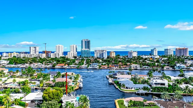 a front view of a house with a yard and flowers