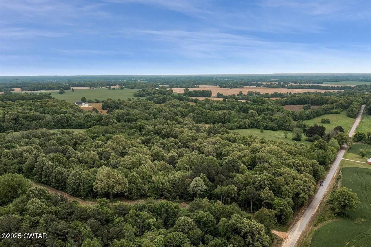 105 Booth Road Trenton, TN 38382 - Photo 2 of 21 an aerial view of residential houses with outdoor space and trees