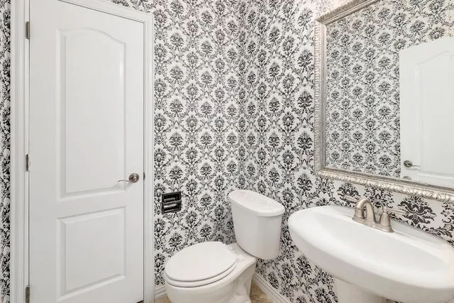 a bathroom with a toilet and a sink