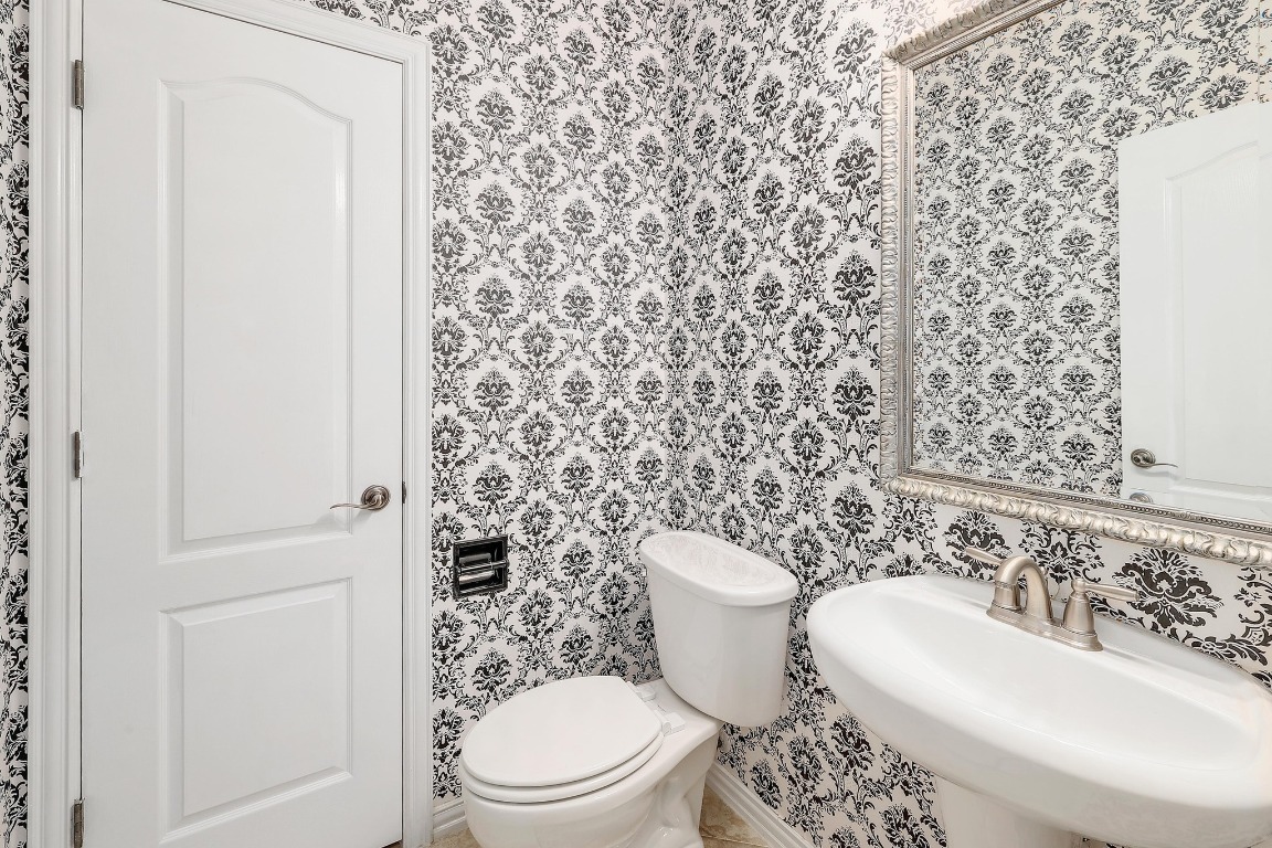 1900 Alamo Bound Leander, TX 78641 - Photo 23 of 38 a bathroom with a toilet and a sink